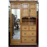 A VICTORIAN ASH WARDROBE BY JAMES SHOOLBRED AND CO, WITH PANELLED AND MIRROR INSET DOORS, RECESS AND