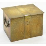 A BRASS COAL BOX, HAMMER TEXTURED WITH FLAT LID AND CARRYING HANDLES, 46CM L, SECOND QUARTER 20TH
