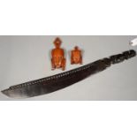TWO SOUTH EAST ASIAN CARVED WOOD MASKS AND AN INDIAN EBONY SWORD WITH ELEPHANT HILT, 78CM L Good