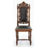 A VICTORIAN CARVED OAK SIDE CHAIR WITH PADDED BACK AND SEAT, SEAT HEIGHT 47CM Joints loose