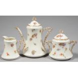 AN ART NOUVEAU LIMOGES TEA SET OF TEAPOT AND COVER, SUCRIER AND COVER AND MILK JUG, WITH PIERCED
