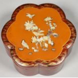 A JAPANESE LACQUER BOX AND COVER, THE COVER APPLIED WITH CARVED AND ENGRAVED MOTHER OF PEARL BIRDS