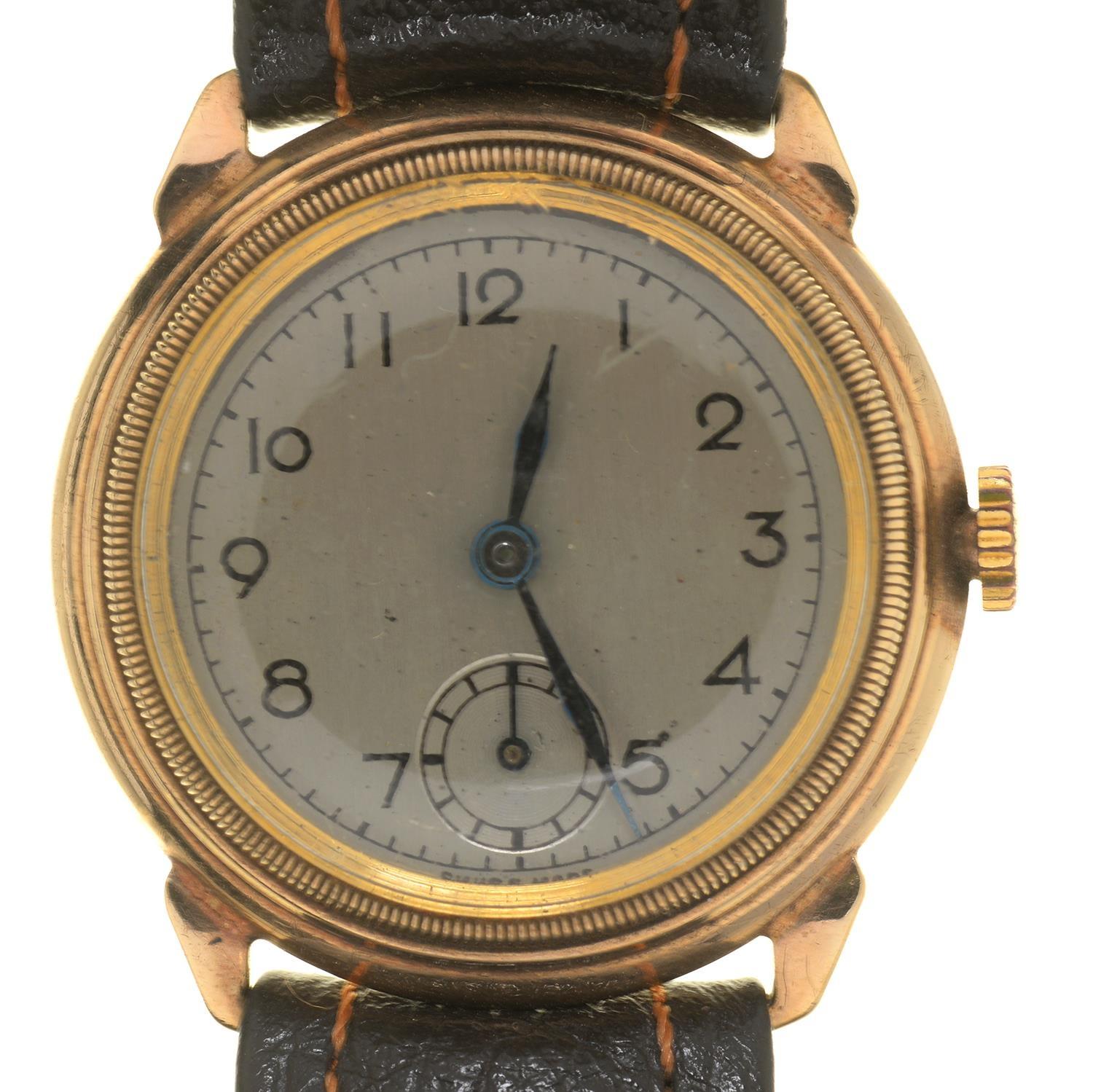 A 9CT GOLD WRISTWATCH WITH MILLED BEZEL AND 'BUBBLE' BACK, 29MM DIA, CHESTER 1943 Working order,
