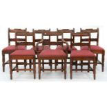 A SET OF SEVEN VICTORIAN MAHOGANY DINING CHAIRS, WITH TABLET CENTRED, LEAF CARVED CENTRE RAIL, ON