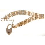 A GOLD GATE BRACELET AND 9CT GOLD PADLOCK, 17.3G Light wear consistent with age
