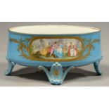 A FRENCH OVAL PORCELAIN JARDINIERE IN SEVRES STYLE, PAINTED WITH 18TH C LOVERS IN A ROMANTIC