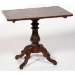 A VICTORIAN MAHOGANY TABLE, THE OBLONG TOP ON BALUSTER PILLAR AND QUADRUPLE PROFILE LEGS, 70CM H; 50
