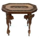 AN INDIAN CARVED TEAK OCCASIONAL TABLE ON FOUR ELEPHANT FORM LEGS, 41CM H; 45 X 53CM, C1930’S