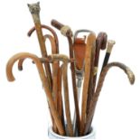 AN EBONY WALKING CANE WITH SILVER POMMEL AND MISCELLANEOUS WALKING CANES AND STICKS, INCLUDING A