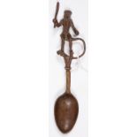 A NORTHERN EUROPEAN BRONZE FINGERIE SPOON, THE ANTHROPOMORPHIC HANDLE IN THE FORM OF A MONKEY