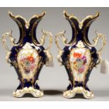 A PAIR OF COALPORT COBALT GROUND TWO HANDLED VASES, PAINTED TO EITHER SIDE WITH FLOWER SPRAYS WITH A