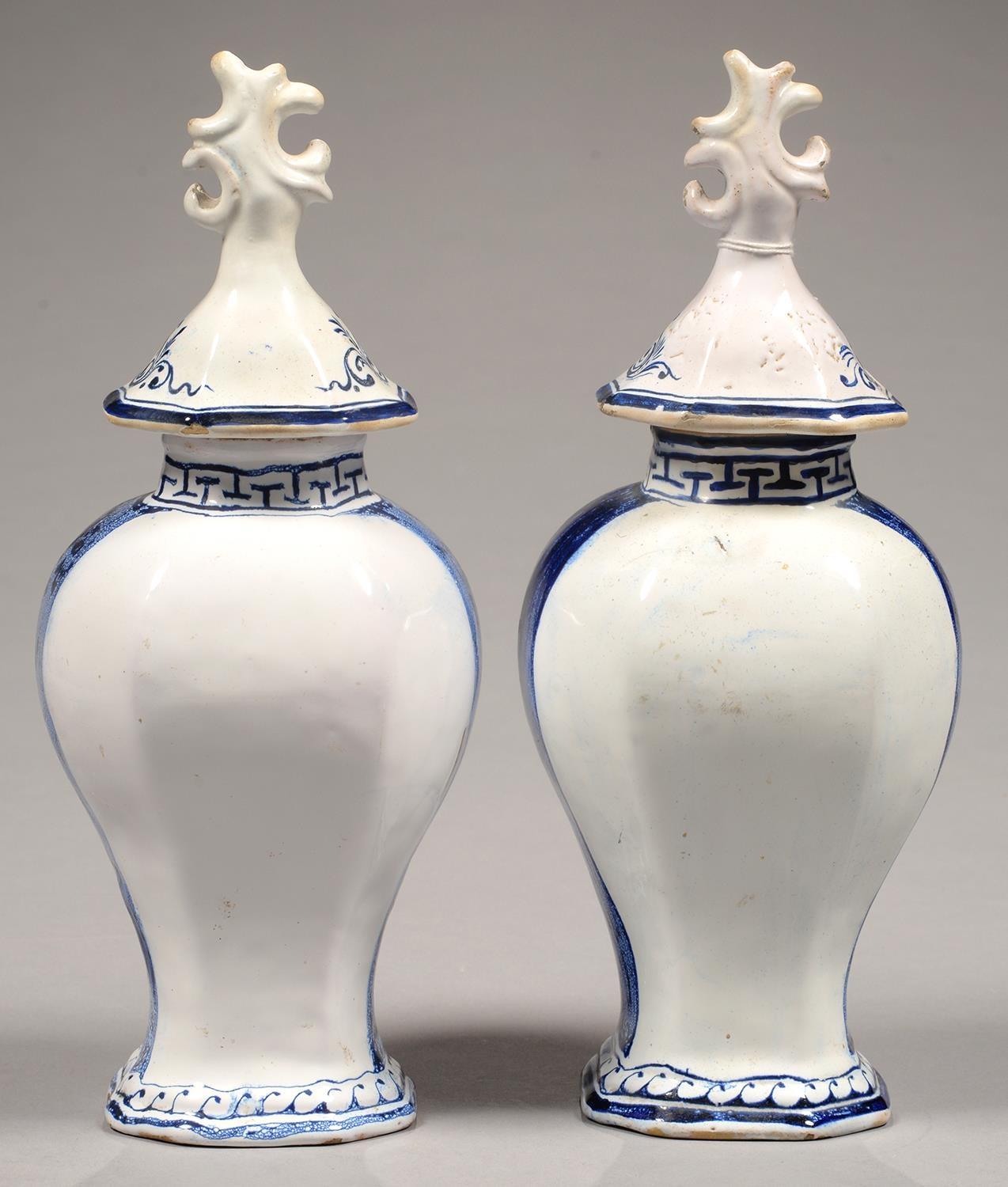 TWO DUTCH DELFTWARE VASES AND COVERS, THE VASES PAINTED WITH A LADY OR GENTLEMAN, 33CM H, 19TH C - Image 2 of 2