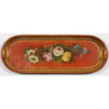 A SCARLET JAPANNED TRAY, PAINTED WITH ROSES AND OTHER FLOWERS IN GILT BORDER, 22 X 61CM Slight wear