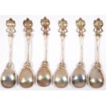 A SET OF SIX ARTS AND CRAFTS EPNS COFFEE SPOONS WITH ENTRELAC STEM AND SEED POD TERMINAL, 11.5CM