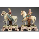 A PAIR OF AUSTRIAN MAJOLICA EQUESTRIAN SPILL HOLDER FIGURES OF A CAVALIER AND LADY, ON FLOWERED