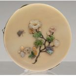 A JAPANESE ROUND IVORY FACED AND BACKED COIN PURSE, ONE SIDE OF SHIBIYAMA WITH FLOWERS AND MOTHS,