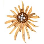 A DIAMOND BROOCH IN THE FORM OF A FLOWER, MOUNTED IN GOLD, 49MM, MARKED 9CT, 13.2G Good condition