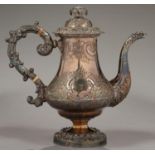 AN OLD SHEFFIELD PLATE COFFEE POT WITH EAGLE'S HEAD SPOUT AND CHASED WITH FLOWERS AND ROCAILLE,