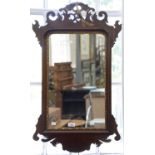 AN 18TH C STYLE PARCEL GILT WALNUT FRETTED FRAME MIRROR, 89CM H, C1900 AND TWO WOOD FRAMED PICTORIAL