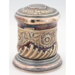 A VICTORIAN CYLINDRICAL SILVER CANISTER AND DOMED COVER, STAMPED WITH TRAILING FLOWERS AND