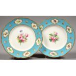 A PAIR OF KERR AND BINNS SEVRES STYLE DESSERT PLATES, PAINTED TO THE CENTRE WITH ROSES, THE BLEU