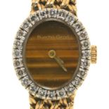 A BEUCHE GIROD 9CT GOLD COCKTAIL WATCH WITH TIGER'S EYE DIAL AND DIAMOND BEZEL, MESH BRACELET AND