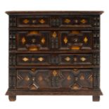 MINIATURE FURNITURE.  A BONE INLAID OAK GEOMETRIC MOULDED CHEST OF DRAWERS  applied with split