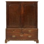 A GEORGE III OAK PRESS, LATE 18TH C  retaining two linen trays enclosed by doors with ogee arched