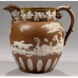 A BROWN STONEWARE HARVEST JUG OF RARE LARGE SIZE, C1825  sprigged with hunting scenes between