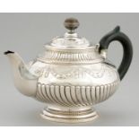 AN IRISH GEORGE IV SILVER TEAPOT  of globular form,  chased with festoons, silver banded wood