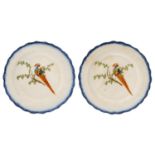 A PAIR OF PEARLWARE PEAFOWL PLATES, C1810  decorated in the Pratt manner with a bird on a branch, in