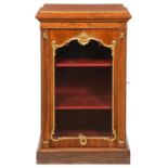 A VICTORIAN PARCEL GILT ROSEWOOD PIER CABINET, C1840  with stepped top, the glazed door framed by