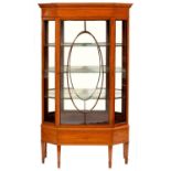 AN EDWARDIAN SATINWOOD AND CROSSBANDED SPLAY-FRONT CHINA CABINET, C1910  with dentil cornice and