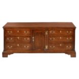A GEORGE III OAK DRESSER, NORTH WALES/NORTH WEST REGION, EARLY 19TH C the central door with raised