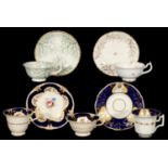 THREE ROCKINGHAM CUPS AND SAUCERS AND A TRIO, C1830-42 various shapes, the trio painted with