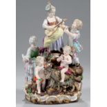 A MEISSEN GROUP OF SEVEN MERRYMAKERS, THE LAENDLICHES FEST, C1870  the couple and children with a