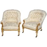 A PAIR OF VICTORIAN CREAM PAINTED AND  PARCEL GILTWOOD CHAIRS, C1860 the swept arms and seat rail