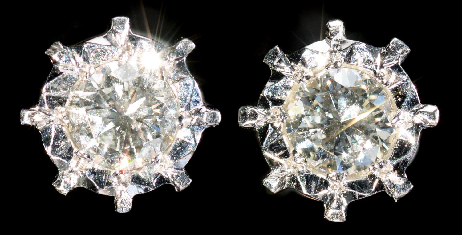 A PAIR OF DIAMOND EAR STUDS  with round brilliant cut diamonds mounted in white gold, 6mm,  2g