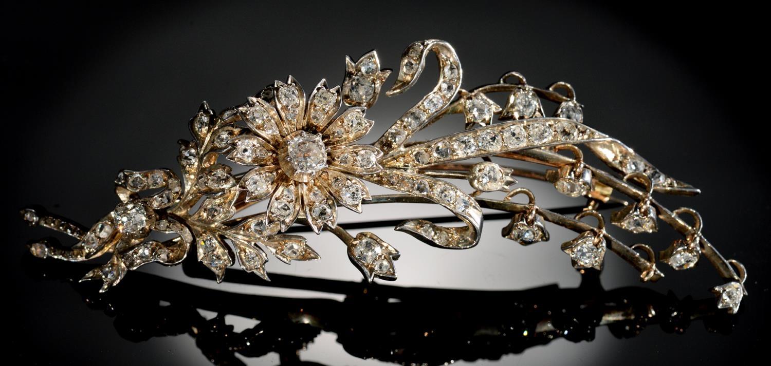 A BELLE EPOQUE DIAMOND SPRAY BROOCH, C1900  the flowerheads en tremblant, mounted in silver and