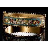 AN ITALIAN SILVER GILT AND MICROMOSAIC BANGLE, C1870  one side decorated with birds, the other