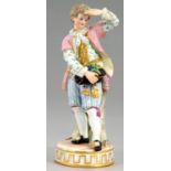 A MEISSEN WINEMAKER FIGURE OF A BOY, 19TH/20TH C  after the model by Michel Victor Acier, 16cm h