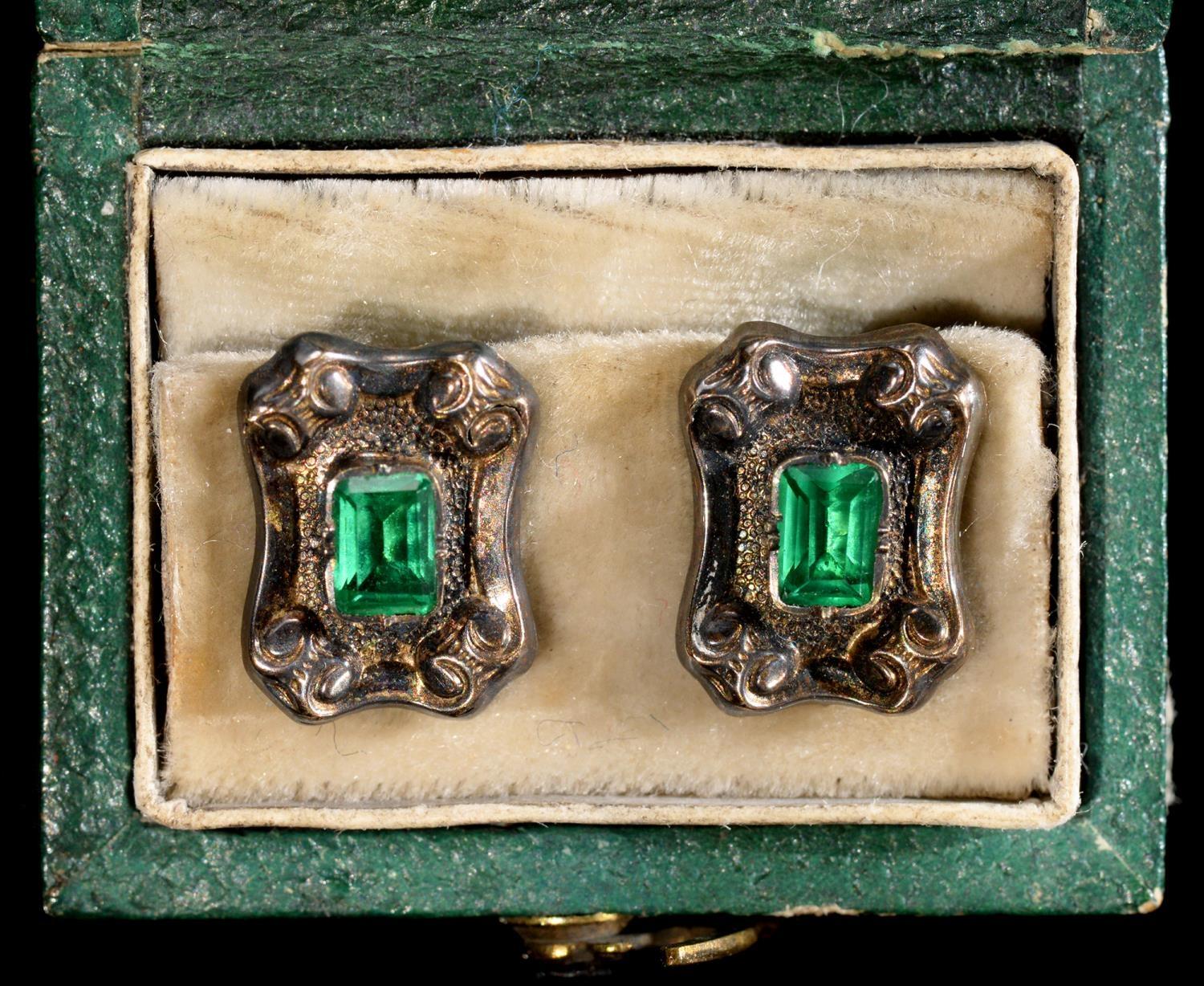 A PAIR OF FRENCH FOILED GREEN PASTE, SILVER AND GOLD DRESS STUDS, 19TH C  10 x 13mm, tete d'aigle