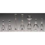 SEVEN ENGLISH CUT OR FACETED GLASS STIRRUP CUPS, 19TH C 11.5-18.5cm hProvenance: (Five) Michael