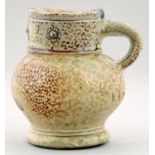 A GERMAN SALTGLAZED STONEWARE MUG, ASCRIBED TO FRECHEN, LATE 16TH C  the cylindrical neck with three