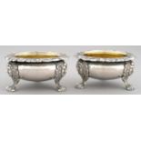 A PAIR OF SCOTTISH VICTORIAN SILVER SALT CELLARS  with foliate chased rim and mask feet, 8.5cm diam,