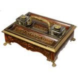 A FRENCH ROSEWOOD AND CUT BRASS INLAID  'BOULLE' INKSTAND, MID 19TH C  with ormolu handle and four