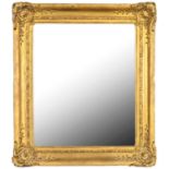A WALL MIRROR REUSING A VICTORIAN GILTWOOD AND COMPOSITION PICTURE FRAME, LATE 19TH C 98 x 84cm