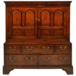 A GEORGE III OAK PRESS CUPBOARD, LATE 18TH C  the upper part with cavetto cornice and enclosed by