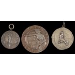 SPORT.  ONE SILVER AND TWO SILVER PLATED ELECTROTYPE PRIZE MEDALS, EARLY 20TH C  one of football