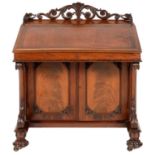 AN EARLY VICTORIAN MAHOGANY DAVENPORT OF UNUSUAL PROPORTIONS, C1840-50   the interior fitted with